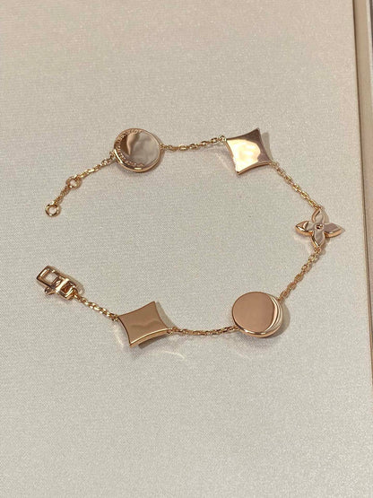 [Windsor Jewelry]STAR AND SUN 5 MOTIF MOP PINK GOLD BRACELET
