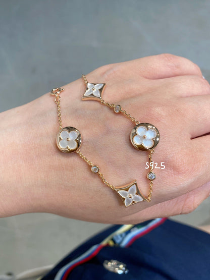 [Windsor Jewelry]STAR AND SUN 4 MOTIF WHITE MOP PINK GOLD BRACELET